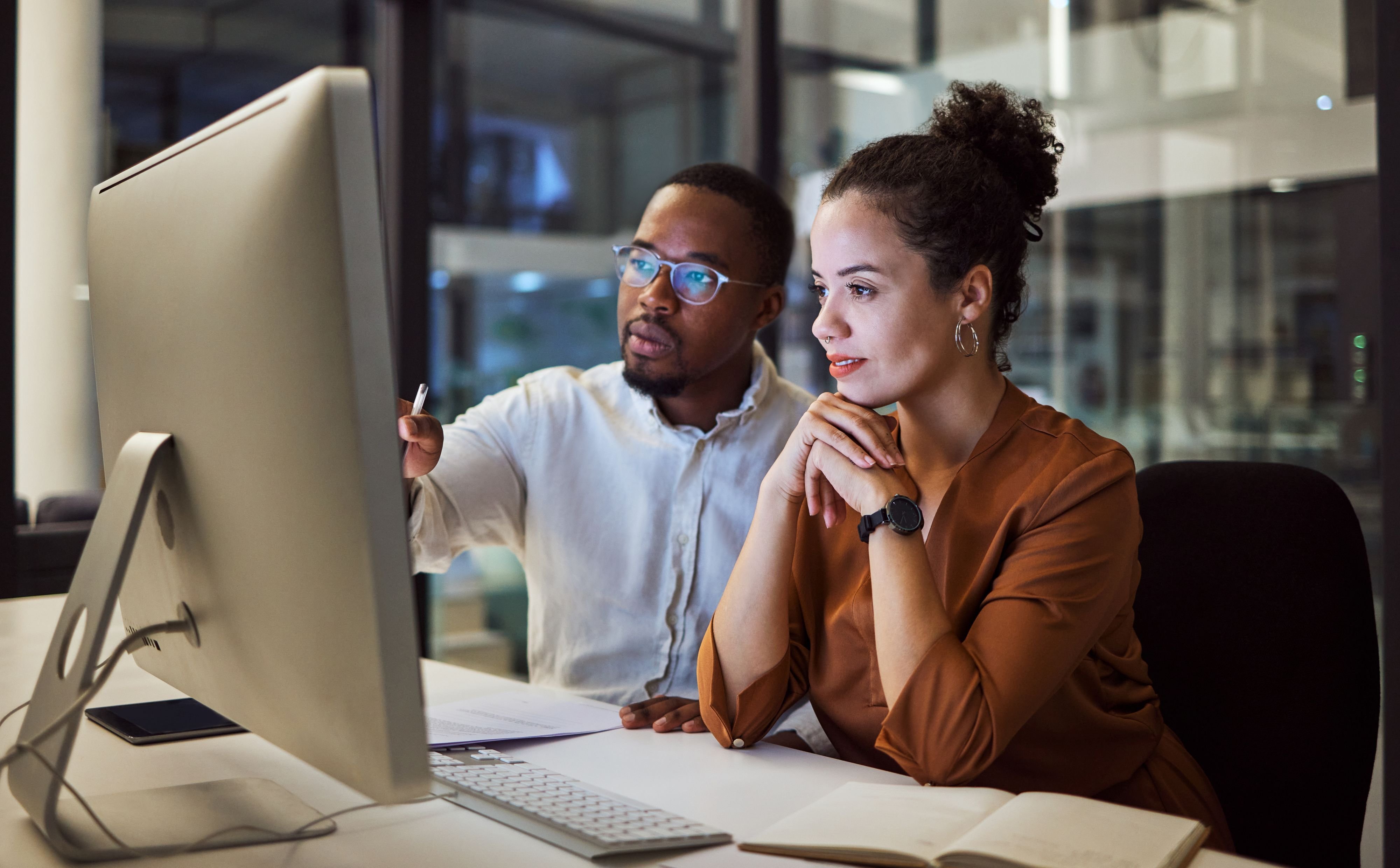 Man and woman office setting smiling 2