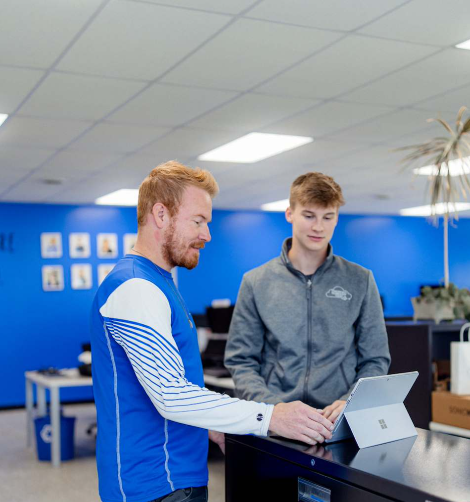 Two men working on computer