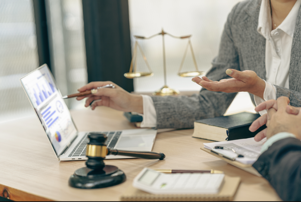 Two people on laptop in law office